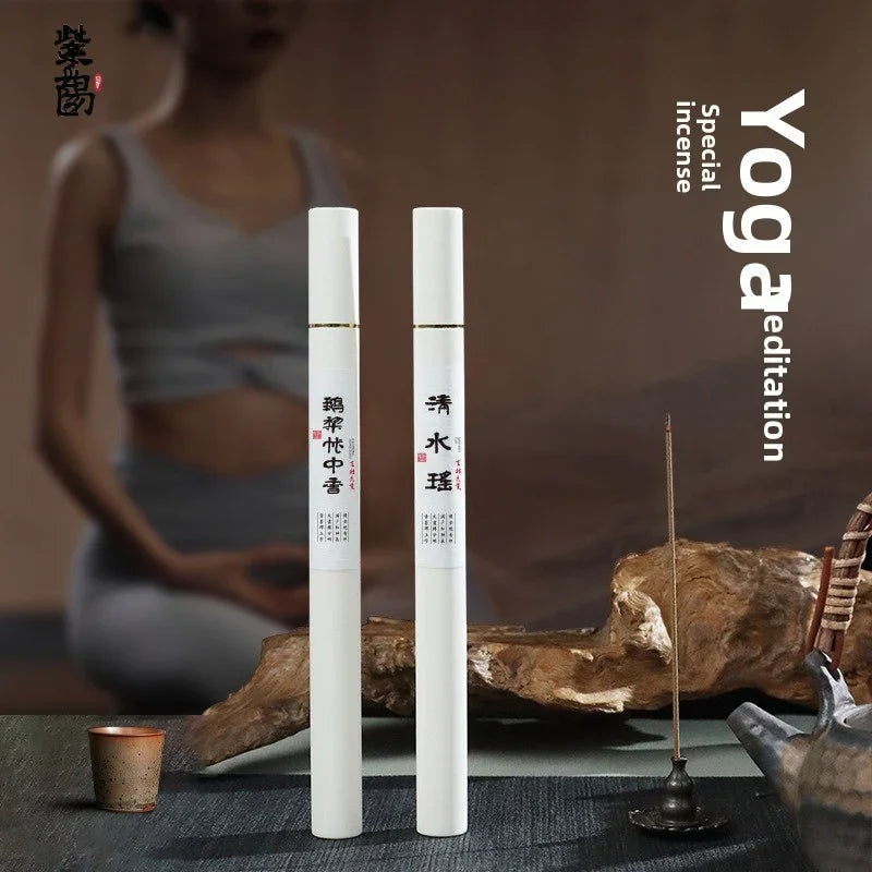 Yoga meditation special incense sticks with Asian calligraphy, incense holder, and tea pot on table