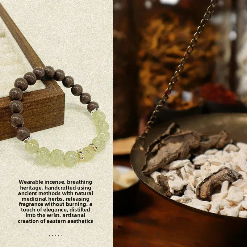 Handcrafted wearable incense bracelet with brown and pale green beads beside traditional incense burning bowl