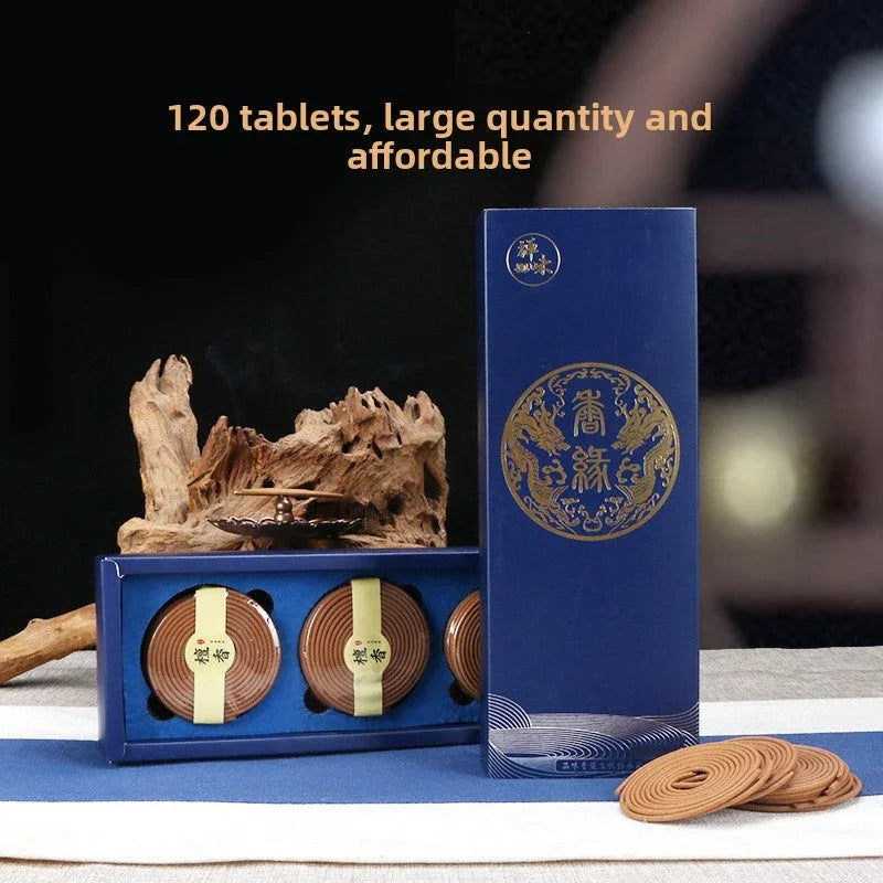 Blue box set with 120 affordable incense coil tablets and wooden incense holder on table