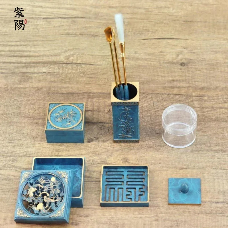 Traditional blue Chinese seal carving tools and carved seals set on wooden surface