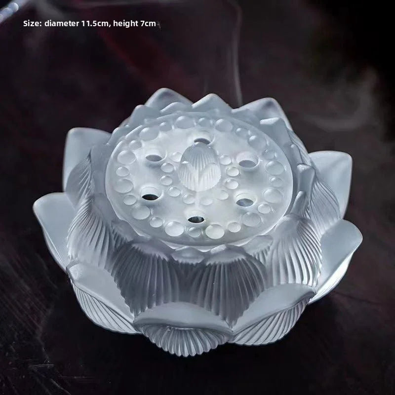 Frosted glass lotus-shaped incense holder with smoke on dark surface, 11.5cm diameter