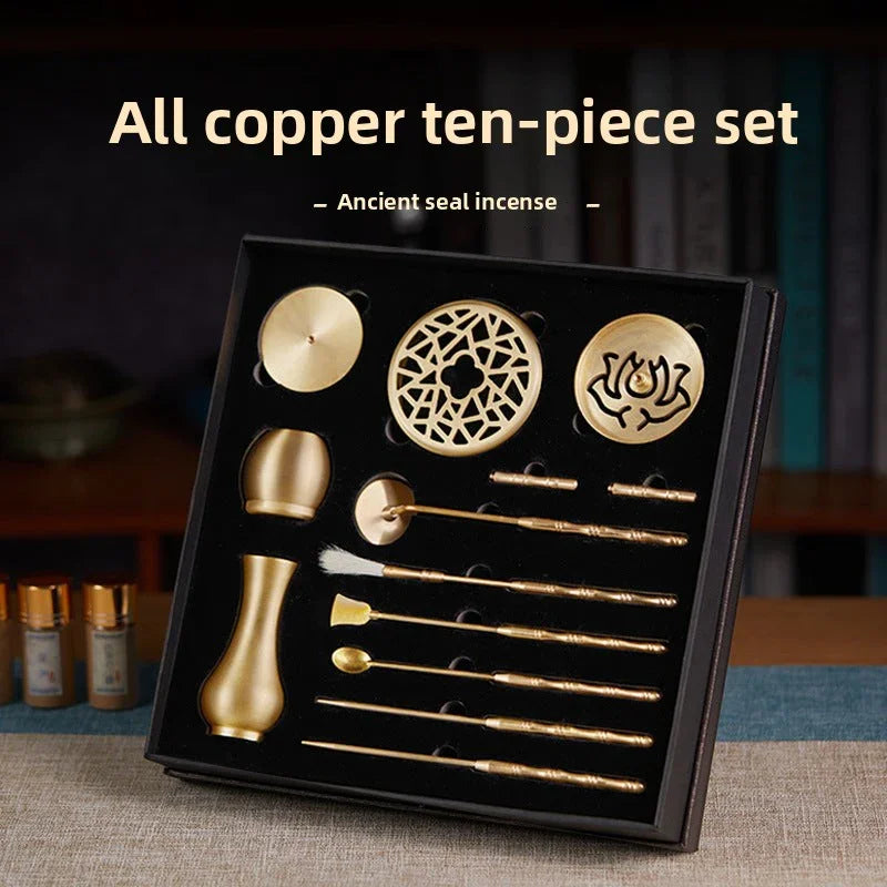 All copper ten-piece ancient seal incense set displayed in black box on table