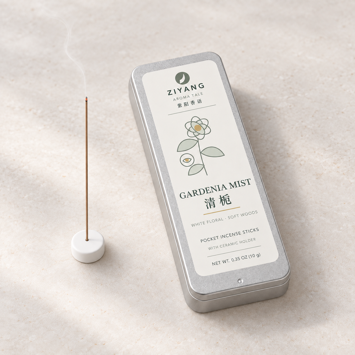 Thin incense stick burning in the included white ceramic holder