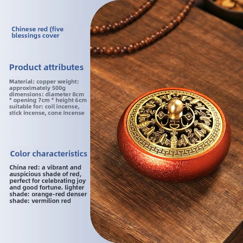 Chinese red copper incense holder with golden five blessings cover on wooden surface
