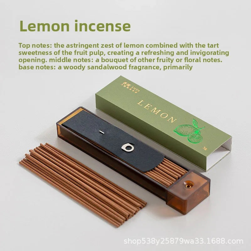Lemon incense sticks in brown holder with green lemon-scented incense packaging box on white background