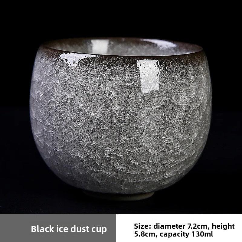 Black ice dust ceramic cup with textured crackled glaze on black background