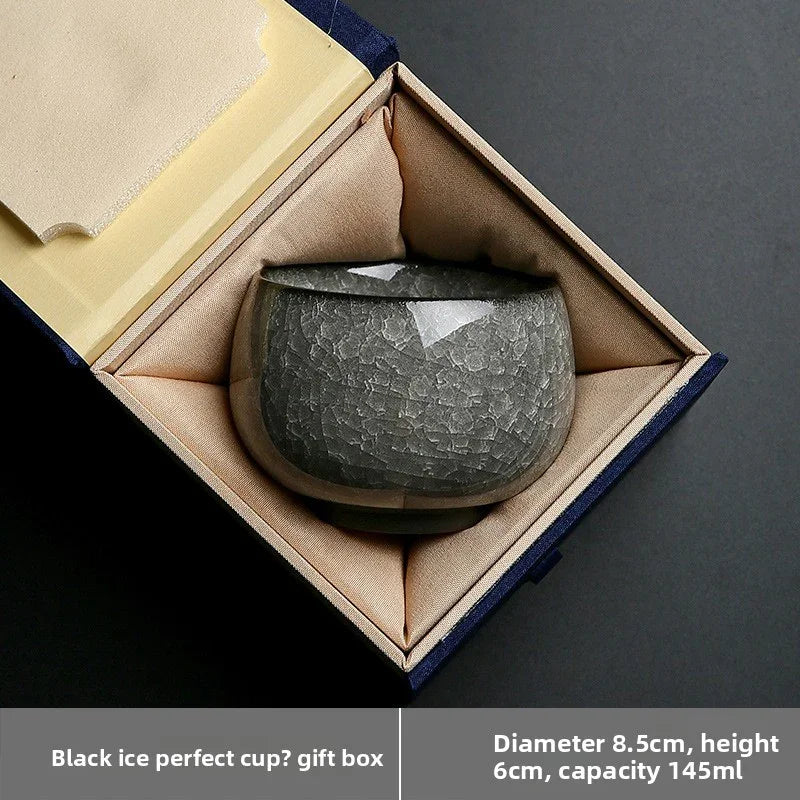 Glossy black ceramic cup with textured ice crack design in beige silk-lined blue gift box