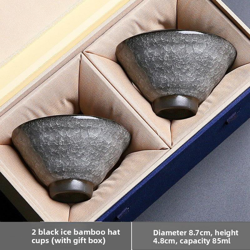 Two black ice bamboo hat ceramic cups with textured surface in beige cushioned gift box