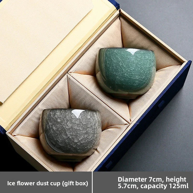 Two crackle-glazed ice flower dust cups in green and gray in a cushioned gift box