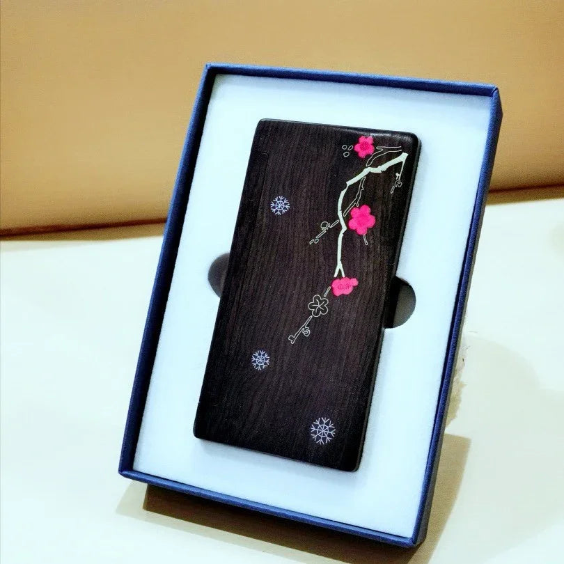 Elegant dark wooden phone case with pink floral and key design in blue gift box