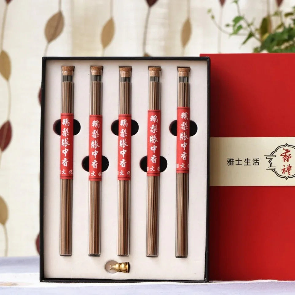 Set of five incense stick tubes with red labels in black box and red packaging with Asian calligraphy