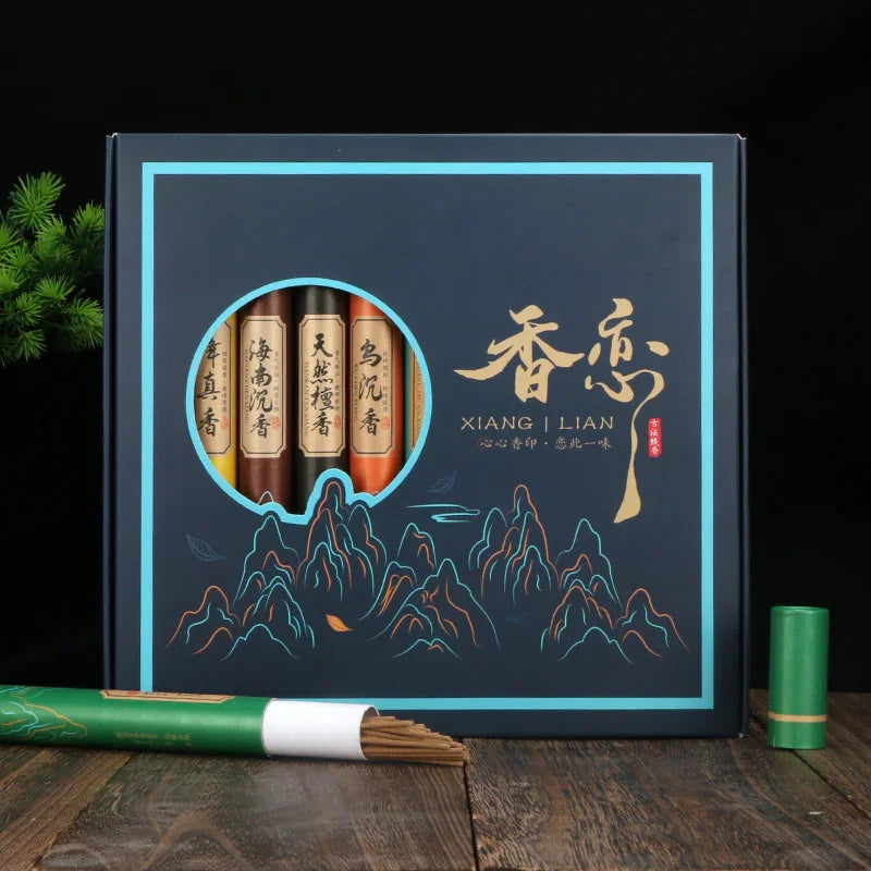 Xiang Lian incense gift set with four tubes, mountain design, and green incense holder on wooden table