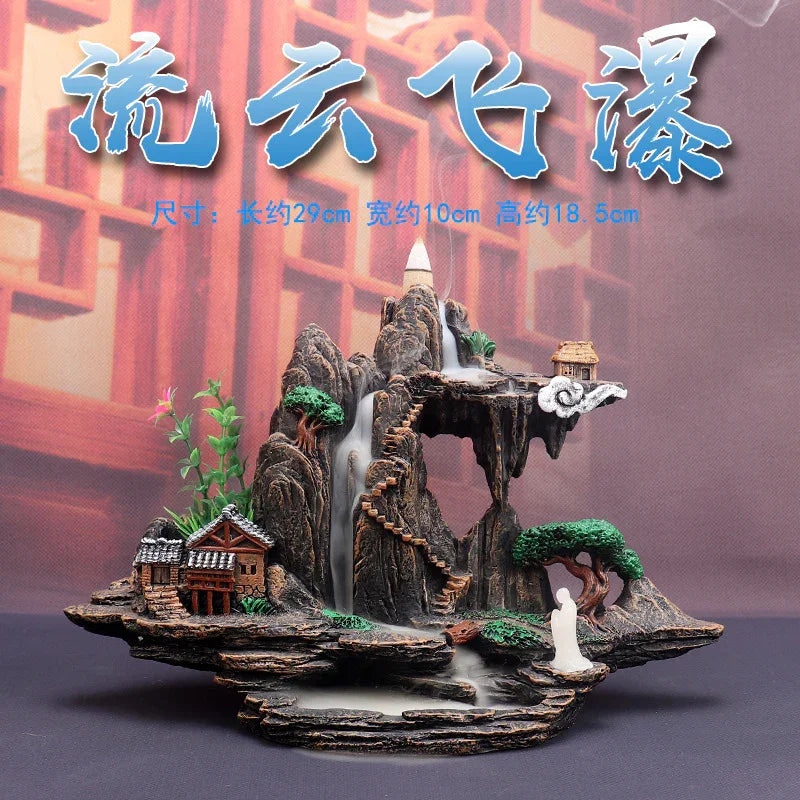 Decorative desktop waterfall sculpture with rocky mountain, stairs, trees, houses, and white figurine