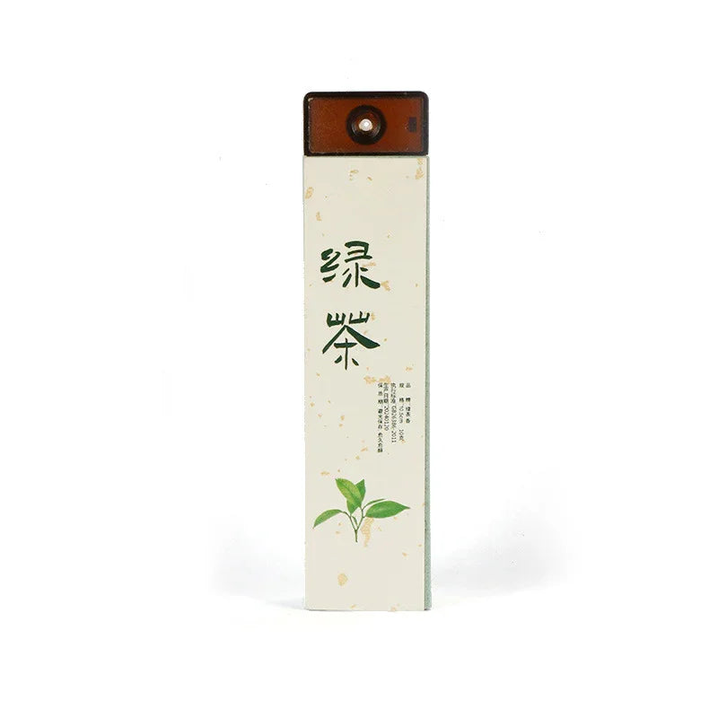 Tall rectangular green tea packaging with Chinese characters and green tea leaves illustration