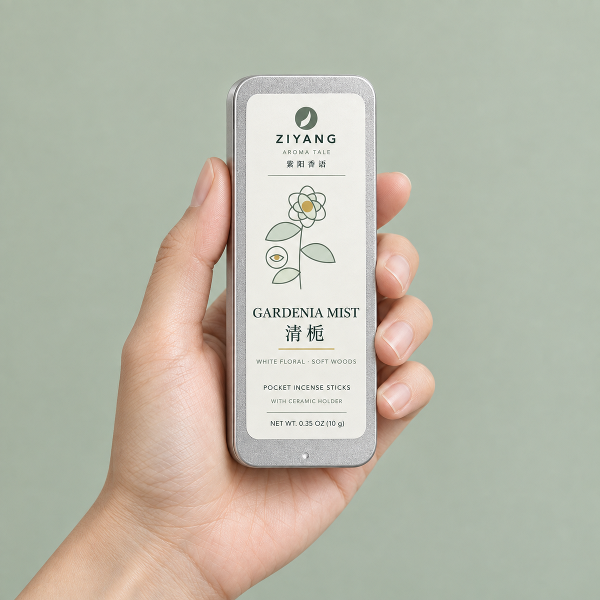 Gardenia Mist pocket incense tin held in one hand