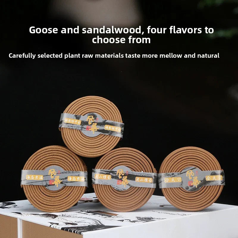 Four coiled incense sticks with labels, featuring goose and sandalwood flavors, on a decorative box