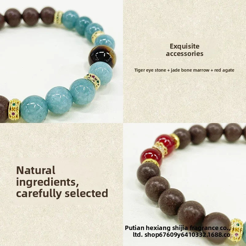 Close-up of handmade beaded bracelets with tiger eye stone, jade bone marrow, red agate, and decorative gold spacers