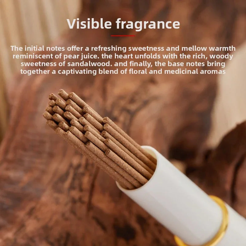Close-up of brown incense sticks inside white holder on wooden surface with fragrance description text