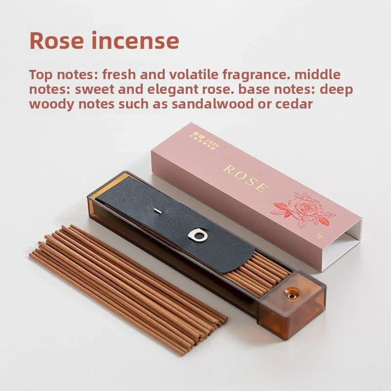 Rose incense sticks with pink packaging and black holder, featuring fresh floral and woody sandalwood notes
